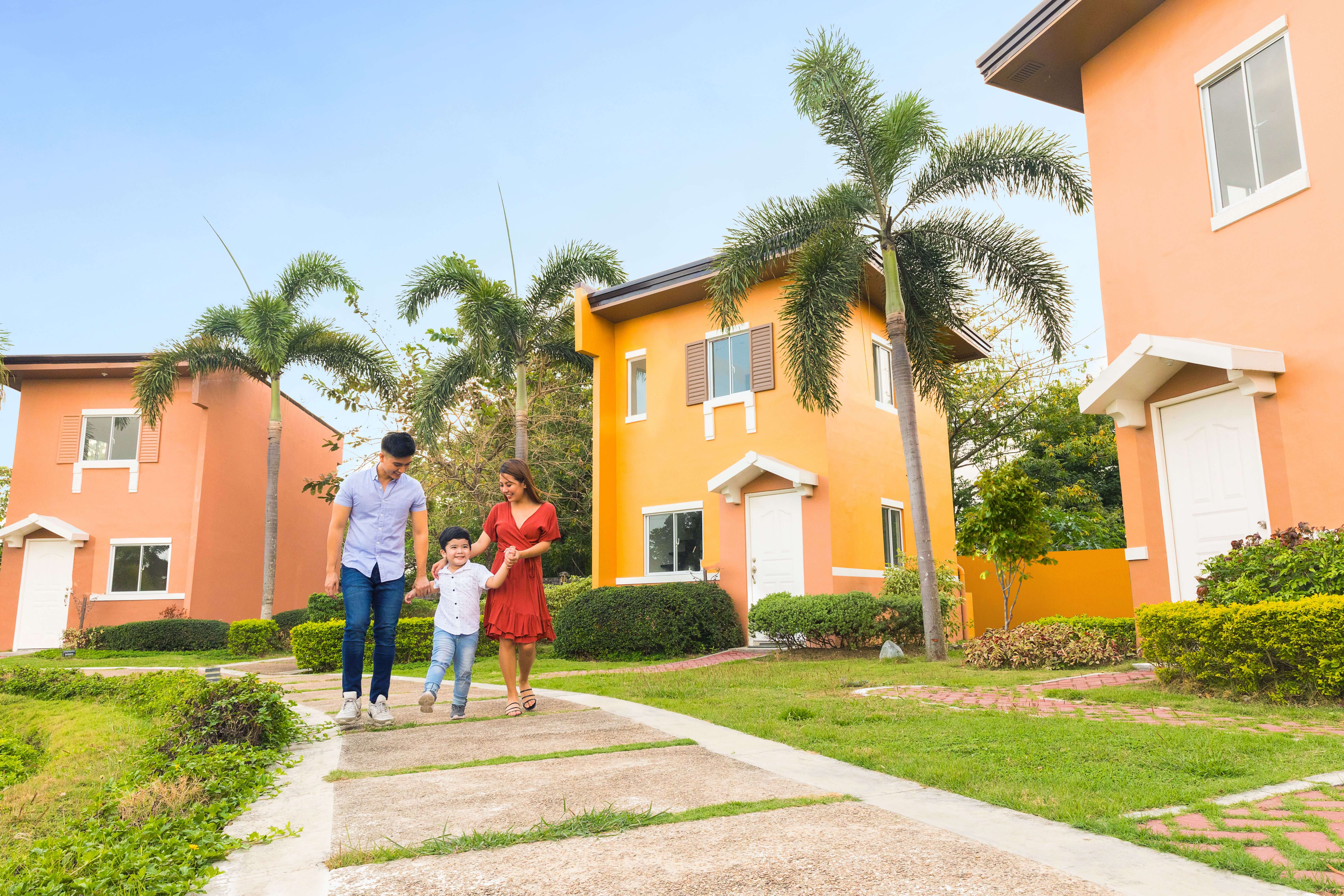 Family strolling inside lessandra community