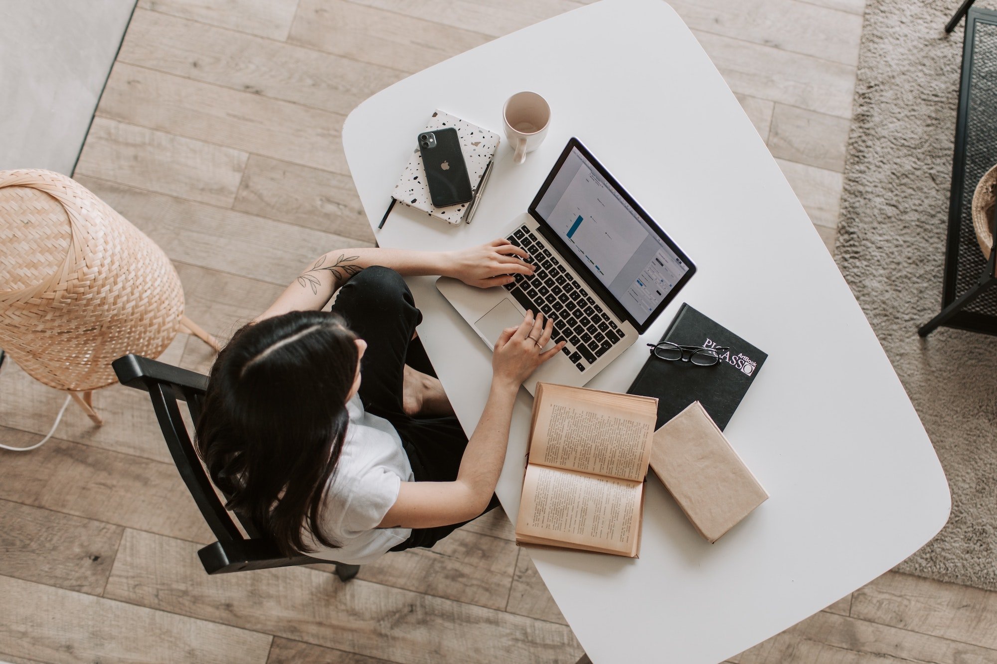 Investment 101 Woman on table with laptop and book Photo by Vlada Karpovich from Pexels