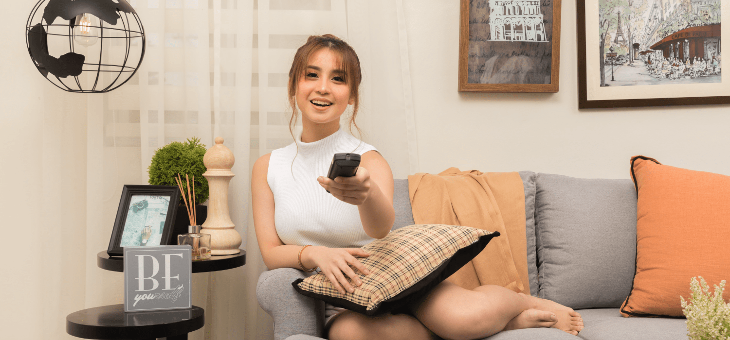 woman watching tv inside lessandra house